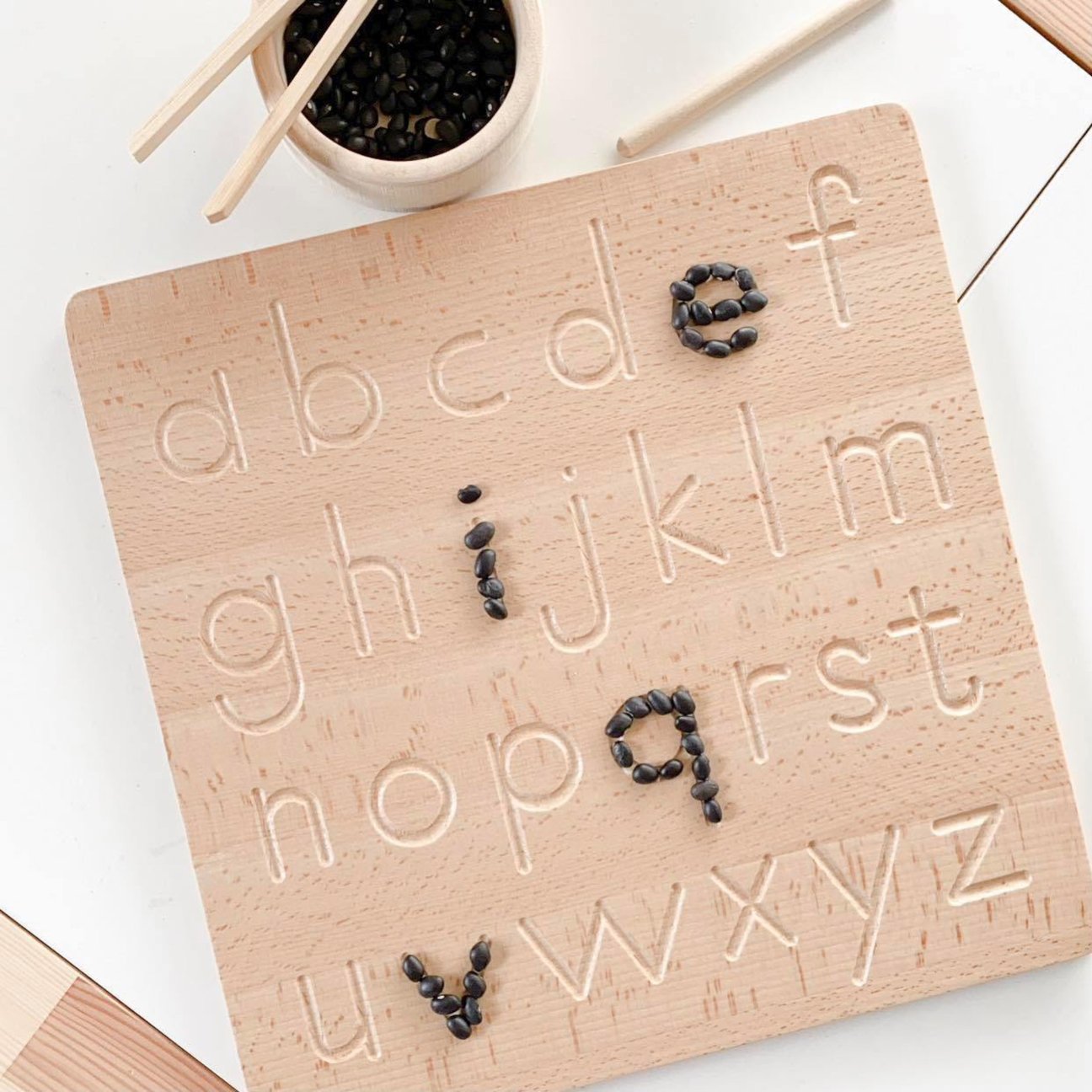 Double sided alphabet tracing board